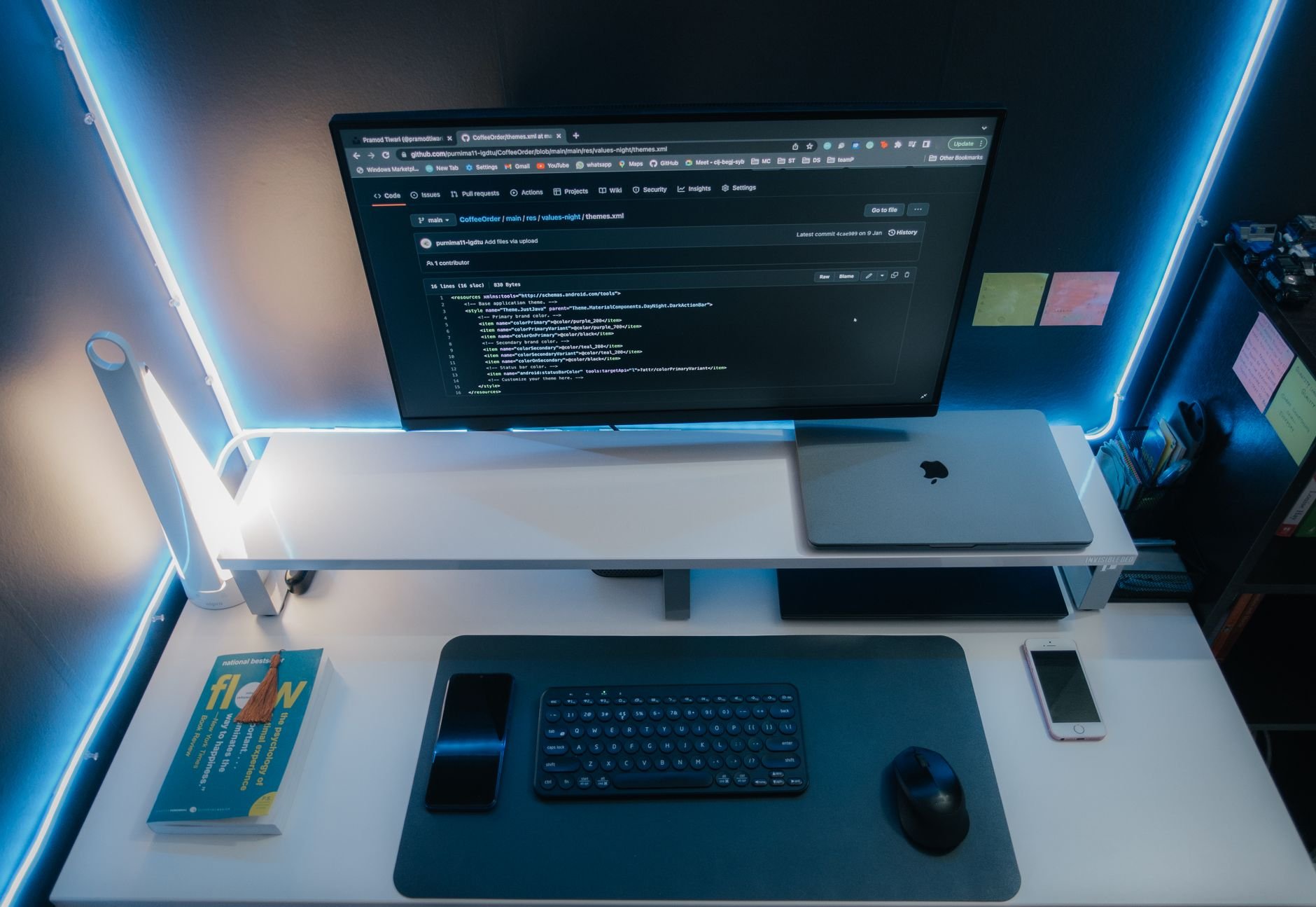 Minimalist workspace with neon lighting — DemoReel production environment